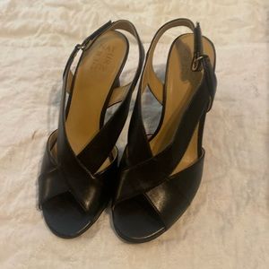 Black leather crisscross 21/2 inch heels.  Brand new never worn.